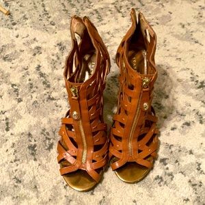 Brown leather and gold zipper heels